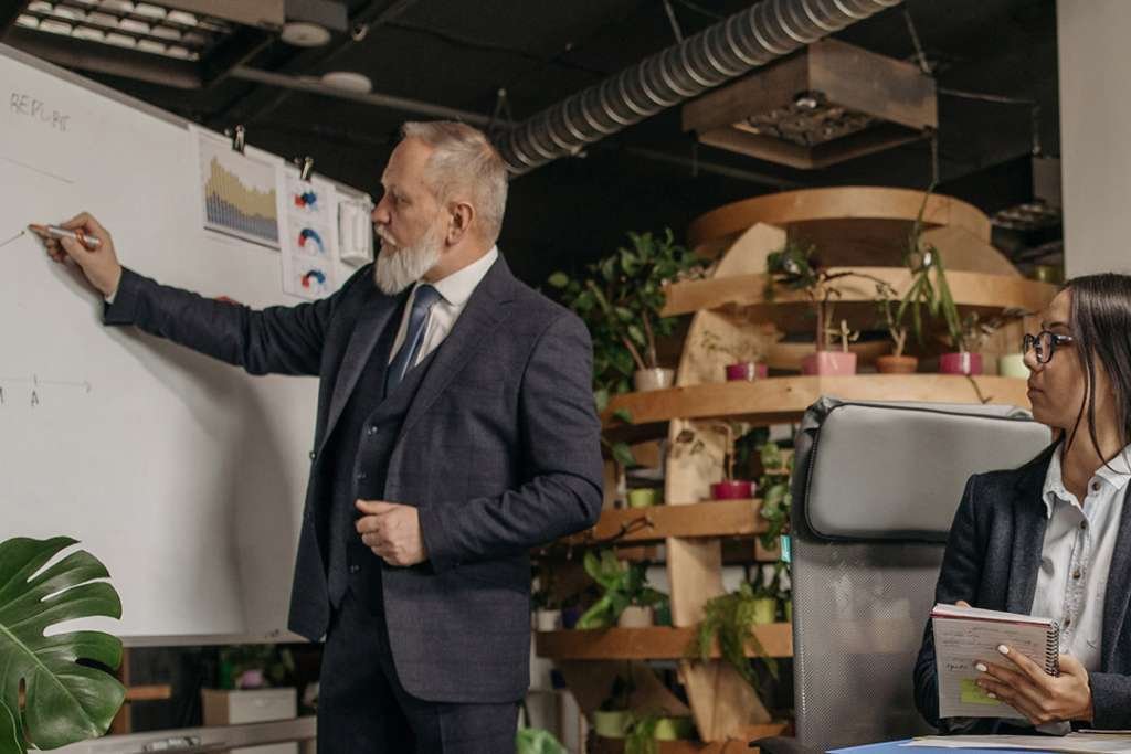 Commercial office boardroom meeting with staff
